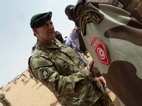 Special Operations Command Africa Commander General, U.S. Army Maj. Gen. James Linder, congratulates Tunisian special forces after a successful multi-national demonstration on Mar. 7, 2015 in the vicinity of Mao, Chad. The soldiers completed three weeks of training in austere conditions as part of the Flintlock 2015 exercise. (Photo by U.S. Air Force Maj. Nathan Broshear/RELEASED)