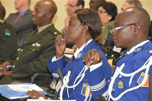 Commandant Ngarhordje Dedjiri and her colleague from Chad hear opening comments at the U.S. AFRICOM's Fourth Africa Accountability Colloquium (ACIV) on “Responding to Gender Based Violence During Peace Operations.”  Nearly 40 military legal professional and commanders from 20 African countries have come together in an effort to lay the foundation for responding to sexual violence allegations that occur during peacekeeping operations.  The annual event is once again being hosted by the International Institute of Humanitarian Law (IIHL) in Sanremo, Italy, Mar. 1-3, 2016.  (U.S. Africa Command photo by Brenda Law/RELEASED)