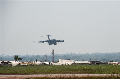 Strategic Lift: A U.S. C17 cargo plane arrives in Bangui, Central African Republic, Dec. 15, 2015. Both the U.S. and France provided military manpower in Libreville, Gabon, and the Central African Republic’s capital, Bangui, to help with the loading/unloading and transport of equipment.  The result was the timely deployment of more than 450,000 pounds of vital equipment and vehicles for the Gabonese military. (Photo courtesy of French military, ADC Laminette/RELEASED)