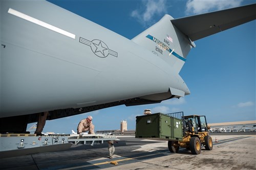 Aerial porters from the Kentucky Air National Guard’s 123rd Contingency Response Group off-load the unit’s gear from a Mississippi Air National Guard C-17 Globemaster III at Léopold Sédar Senghor International Airport in Dakar, Senegal, Oct. 4, 2014, in support of Operation United Assistance. More than 70 Kentucky Airmen arrived with the gear to stand up an Intermediate Staging Base at the airport that will funnel humanitarian supplies and equipment into West Africa as part of the international effort to fight Ebola. (U.S. Air National Guard photo by Maj. Dale Greer)