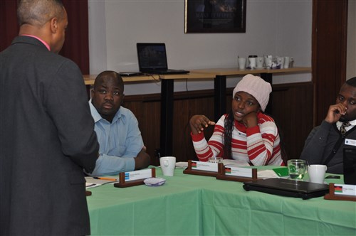 Journalists from Malawi and Botswana receive a briefing by Erik Threet at U.S. Africa Command’s headquarters Nov. 18, 2014.  Ten journalists from Botswana and Malawi are in Stuttgart this week as participants of a media delegation to learn about U.S. Africa Command. The journalists, along with a military public affairs officer from each country, were invited by AFRICOM Public Affairs and selected by U.S. embassy staff to participate in a program designed to enhance journalists' understanding of the command's mission and programs on the continent.