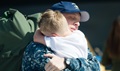 A sailor returning from a seven-month deployment reunites with his family. (U.S. Navy photo by Mass Communication Specialist 3rd Class Andre T. Richard) 
