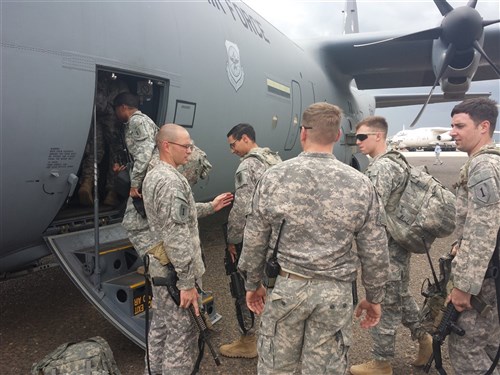 Cavalry scouts assigned to the East Africa Response Force, 1st Infantry Battalion, 18th Infantry Regiment, board a C-130 Hercules in Juba, South Sudan, as they prepare to return to Camp Lemonnier, Djibouti, April 20, 2014. 