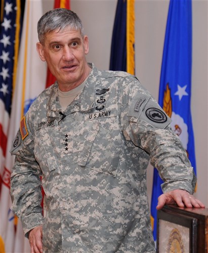 U.S. Army Gen. David Rodriguez, U.S. Africa Command commander, addresses service members deployed to Combined Joint Task Force-Horn of Africa and Camp Lemonnier during an all-call at Camp Lemonnier, Djibouti, April 16, 2013. This marked the general's first trip to Djibouti and Africa since assuming command of U.S. AFRICOM April 5, 2013. Headquartered in Stuttgart, Germany, U.S. AFRICOM is one of six unified geographic combatant commands in the Department of Defense. (U.S. Air Force photo by Staff Sergeant Caleb Pierce) 