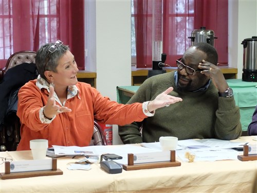 AU journalists, Jenine Coetzer (left), responds to a comment as Charles Obbo looks on during a media delegation visit, Feb. 9, 2015, at Kelley Barracks, U.S. Army Garrison, Stuttgart, Germany.  Eight journalists, who are accredited with the African Union, are here as participants of a U.S. AFRICOM-sponsored media delegation visit to learn about the command's mission and programs. (Photo by Brenda Law/U.S. Africa Command Public Affairs/Released)