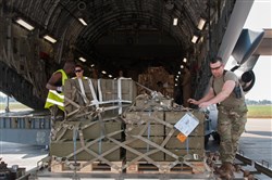 Strategic Lift - U.S. Air Force Crew Loads Aravis:  McGuire Air Force Base and McChord Air Force Base personnel work together to load a Gabonese armored personnel carrier on a C-17 before departing for Bangui, Central African Republic; Dec. 15, 2015, Libreville, Gabon. Both the U.S. and France provided military manpower in Libreville, Gabon, and the Central African Republic’s capital, Bangui, to help with the loading/unloading and transport of equipment.  The result was the timely deployment of more than 450,000 pounds of vital equipment and vehicles for the Gabonese military. (Photo courtesy of French military, ADC Laminette/RELEASED)