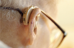 Photo of senior man with hearing aid