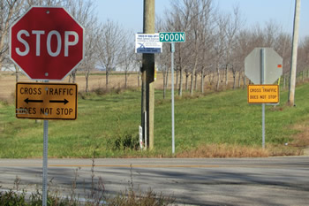 Photo: Pedestrians crossing a Signalized Intersection in a residential area