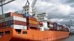 A container ship at docked at sea.