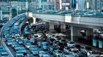 A highway intersection congested with traffic during rush hour. 