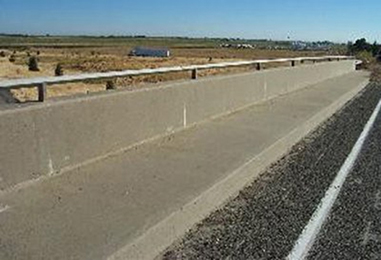 Photograph of a bridge section, showing Concrete Barrier with Sidewalk