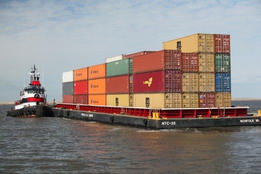 Containers on a barge in water