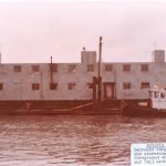 A repurposed barracks barge, used as a shop and storeroom a the Astoria NDRF Anchorage