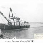 The Beaumont Reserve Fleet's waterfront area, including a view of FS-52, a crane-equipped workboat, in 1953.