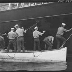 Hoffman Island, merchant marine training center off Staten Island. Trainees painting the schooner Vema.