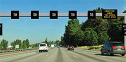 Photo.  SF Park Parking Information Sign.  Signage includes speed limits over each travel lane and textual information in far right lane.