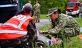 U.S. Navy Petty Officer 1st Class Nichole Gacayan works with Hungarian first responders to assess victims of a simulated vehicle crash during Exercise Anakonda Response 2016, at Papa Air Base. 