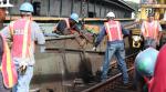 Transit workers on the track