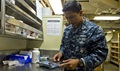 Navy Hospital Corpsman 1st Class Harvey Canto measures medication in the pharmacy. In many patients, when diet and exercise are not enough to sufficiently improve blood pressure and cholesterol values, prescription medications have been proven to save lives. (U.S. Navy photo by Mass Communication Specialist 3rd Class Lacordrick Wilson)