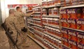Two Marines shop for dietary supplements.