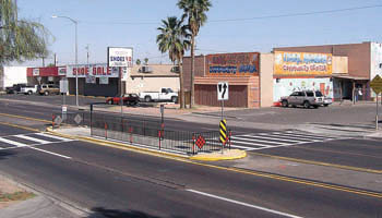 Multistage crossing area in raised median