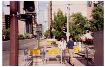 Figure 78. Bedstead Barrier Application. This is an image of two people walking through a bedstead pedestrian barrier.