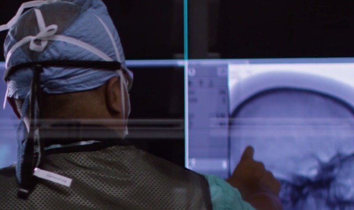 Army Maj. Nicolas Cahanding with Brooke Army Medical Center in San Antonio, Texas, looks at a brain image. (U.S. Army photo by Robert Whetstone) 