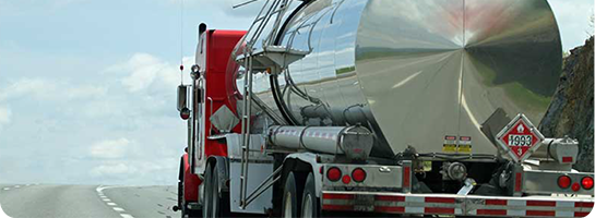 Photo of truck hauling hazardous material tank