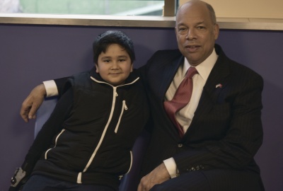 Secretary Johnson sits with Jaafar, an 11 year old turkish refugee 