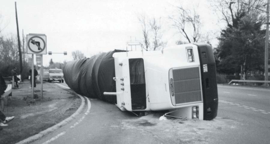 A truck with cargo on its side.