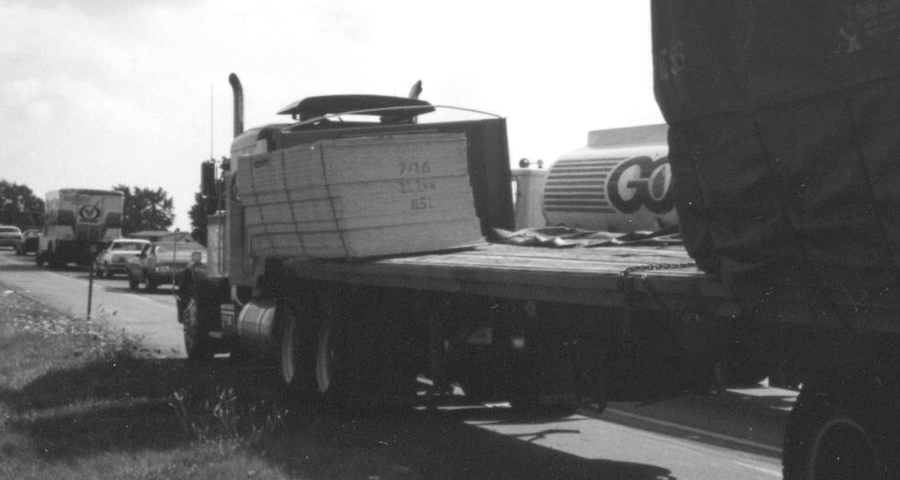 A truck with cargo tipping but not falling over