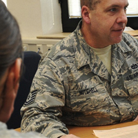 NCO helps service member with her tax return.