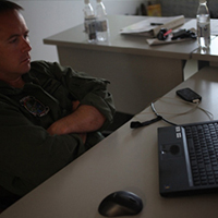 Marine watches his son graduate 5th grade via Skype.