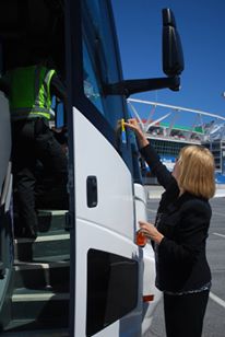 'Last week, Administrator Ferro took part in CVSA’s Roadcheck 2013 at FedEx Field in Landover, Maryland. In this photo the Administrator is placing a CVSA decal on a motorcoach that has passed an inspection.'