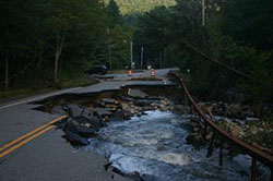 Photograph of a washed out road.