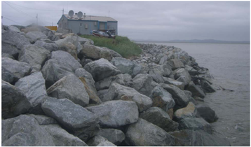 Photo of a rock revetment along a coast.