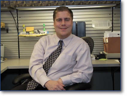 Photo of Jacob Leffler sitting at his desk