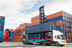 Freight being moved from ship to truck.