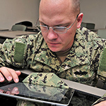 Service member using tablet