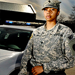 Service member with police car