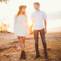 Service member and military spouse hold hands