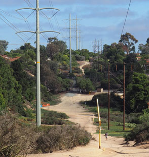 a trail running along powerlines in a rural area.