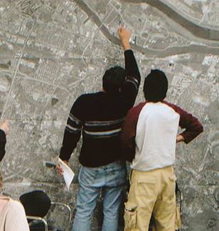 Photograph of workshop participants viewing a map of Savannah.