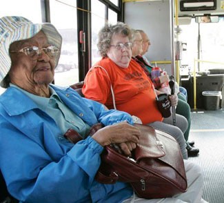 Photo of seniors aboard a transit bus