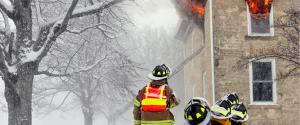 Firefighters battling a home fire