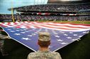 Airmen from Whiteman Air Force Base, Mo., perform a flag detail during Armed Forces Night at Kauffman Stadium in in Kansas City Sept. 8, 2015. The pregame ceremonies included recognition of veterans, wounded warriors and military families, as well as a tribute to fallen service members. (U.S. Air Force photo/Senior Airman Joel Pfiester)