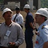 Men wearing hard-hats at a facility assessment