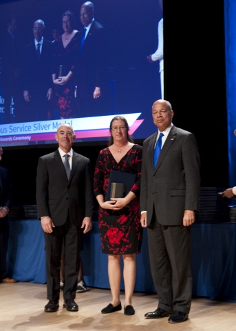 Secretary of Homeland Security Jeh Johnson and Deputy Secretary of Homeland Security Alejandro Mayorkas presented the Secretary's Meritorious Service Medal to Patricia Wolfhope