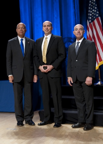 Secretary of Homeland Security Jeh Johnson and Deputy Secretary of Homeland Security Alejandro Mayorkas presented the Secretary's Award for Volunteer Service to Mark E. Hughes, U.S. Secret Service, during the Secretary's Award Ceremony held Oct. 26, 2016.