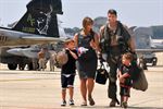 U.S. Navy Cmdr. Michael Esper walks across the flight line with his wife and children during a homecoming celebration at Joint Base Andrews Naval Air Facility Washington in Maryland, Sept. 7, 2010. DoD photo by Petty Officer 2nd Class Clifford H. Davis